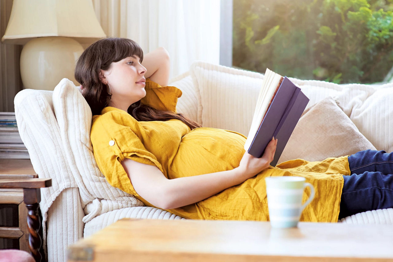 pregnant reading a book