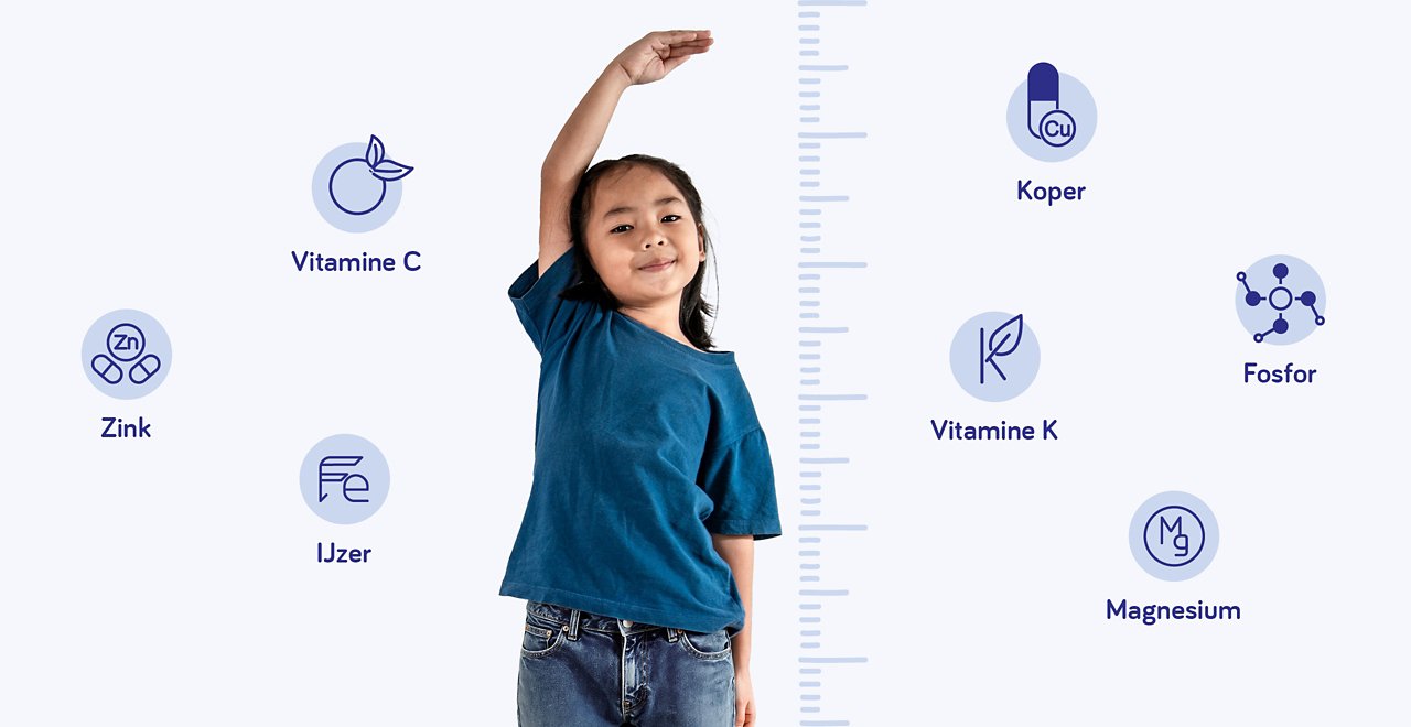 Kind meet lengte met vitamines en mineralen voor groei