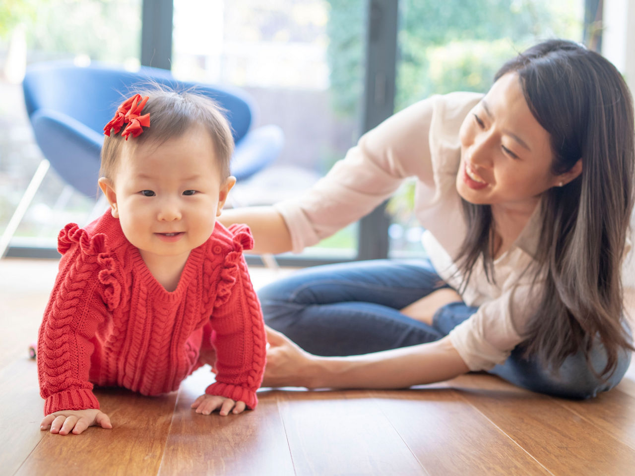 Little girl dressed in red with her mother