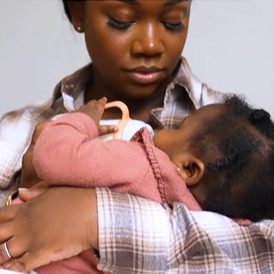 mom holding baby
