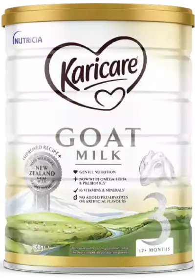 A Karicare goat milk formula tin is shown standing upright against a neutral background. The front of the tin highlights gentle nutrition, omega-3 DHA, prebiotics, and 16 vitamins and minerals, with no added preservatives or artificial flavours. Visuals include a pastoral New Zealand countryside with green hills, a river, and a goat illustration, emphasizing natural origins. The pack indicates 900 g net weight, stage 3 formula, and suitability for children 12+ months.