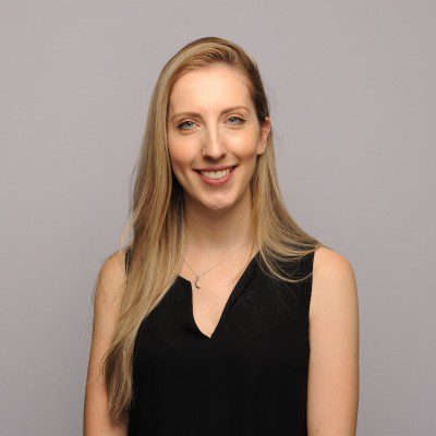 A girl with blonde hear wearing a black shirt
