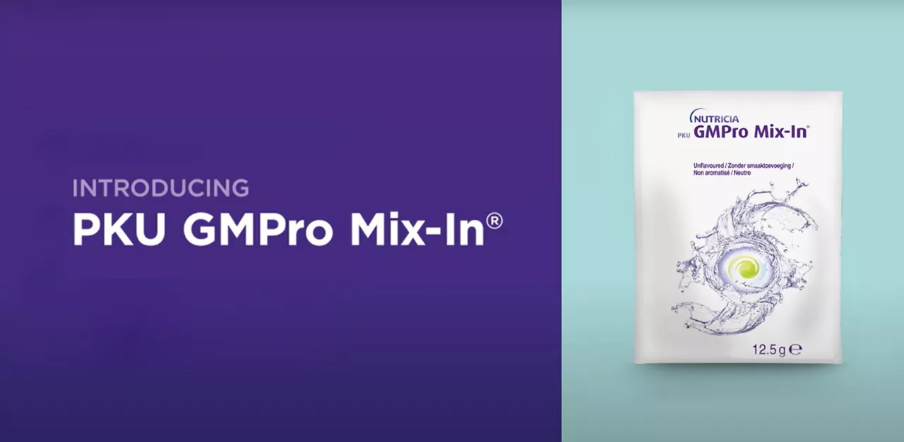 The image showcases a packet of PKU GMPro Mix-In®, a specialized nutritional supplement for protein needs. The setting features a clean, minimal design with a split purple and teal background. The packet displays swirling graphics and the text '12.5 g' indicating the weight of the product. The branding is clearly visible with the product name prominently displayed.