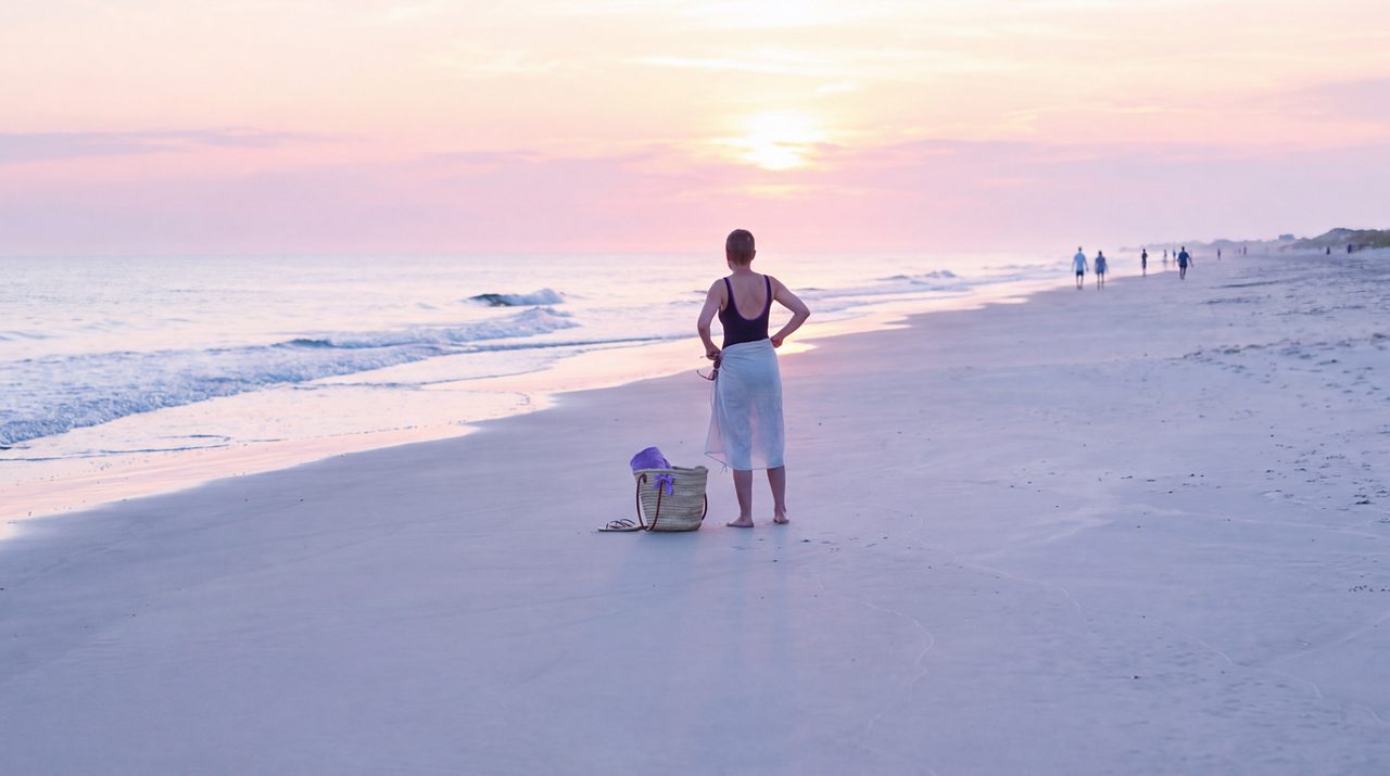 AI generated image of female breast cancer patient looking out to sea.