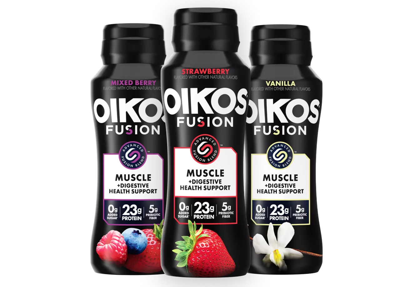 Three Oikos Fusion bottles are displayed featuring Mixed Berry, Strawberry, and Vanilla flavors