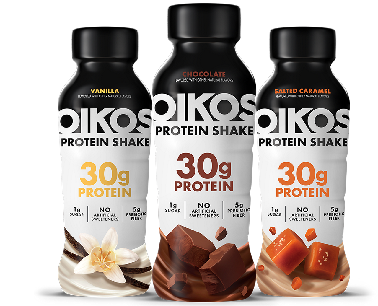 Three Oikos protein shake bottles are displayed in vanilla, chocolate, and salted caramel flavors. Each bottle prominently highlights '30g Protein' along with '1g Sugar', 'No Artificial Sweeteners', and '5g Prebiotic Fiber'. The bottles feature flavor-specific visuals such as vanilla flowers, chocolate chunks, and caramel pieces. The design emphasizes health-focused attributes and natural ingredients.