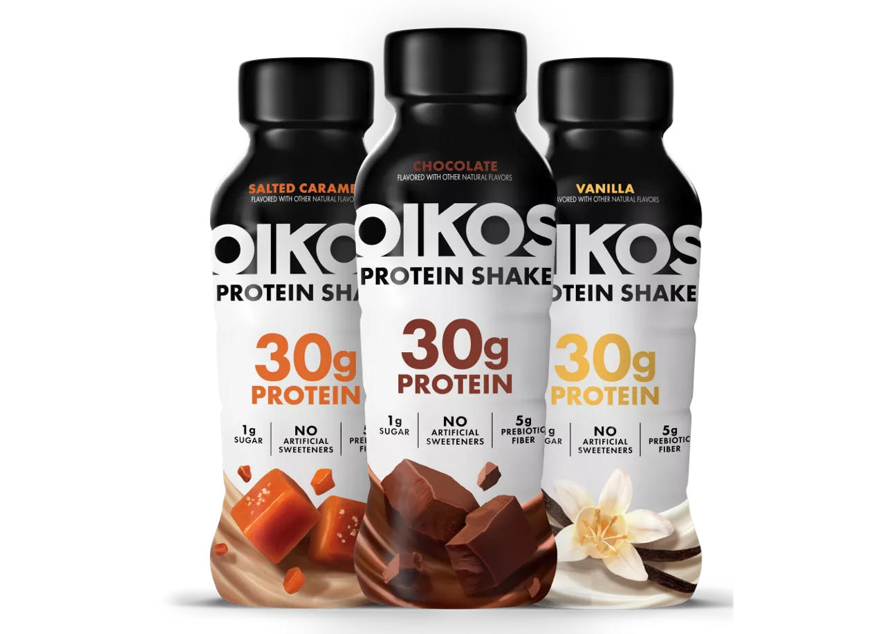 Three Oikos protein shakes in flavors salted caramel, chocolate, and vanilla are displayed