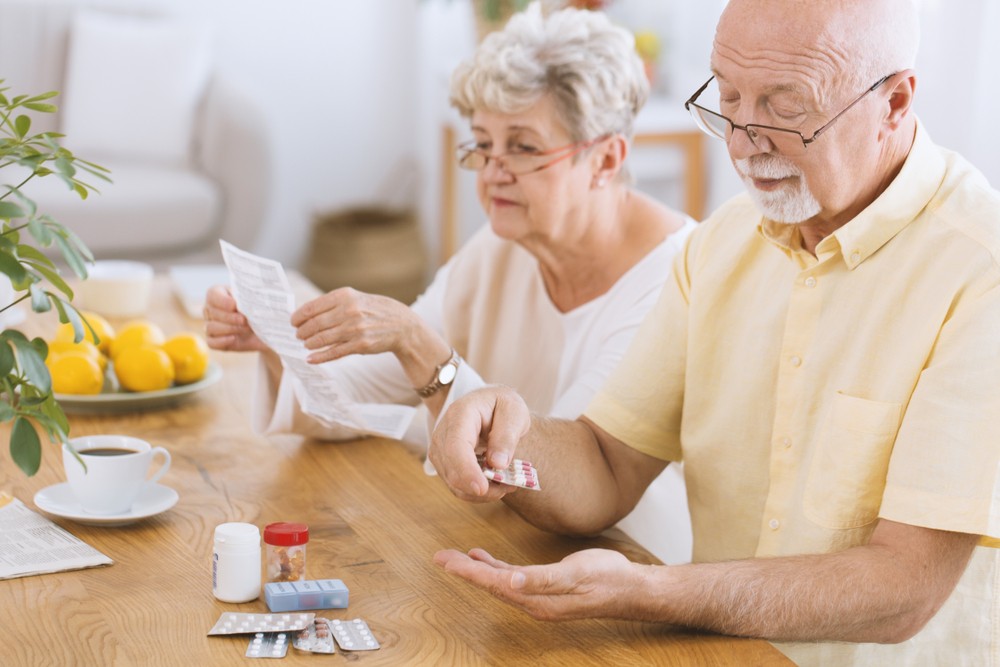 Senior man taking medication for diabetes while his wife reading a prescription; Shutterstock ID 1011163015; Business Division: Advanced Medical Nutrition; Business Unit: Benelux; Name: Danique van der Tas