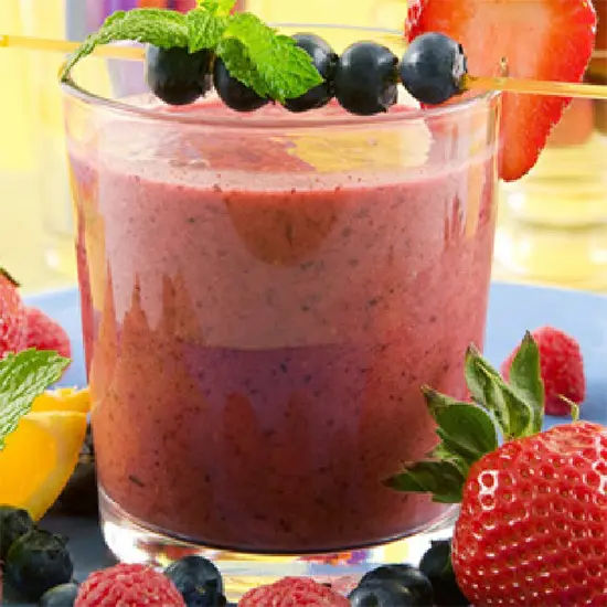Berry smoothie with fresh fruit garnish