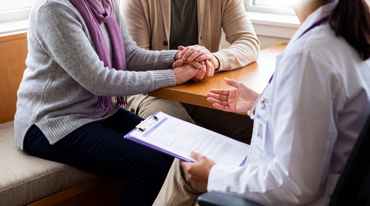 AI generated image of couple in doctors office receiving cancer diagnosis.