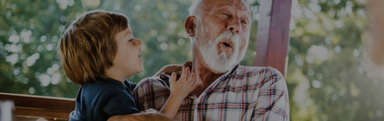 Grandfather and grandson embracing