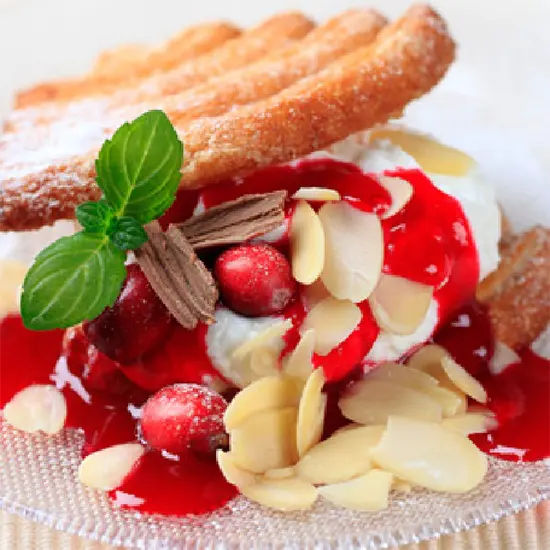 Dessert with berries, cream, and almonds