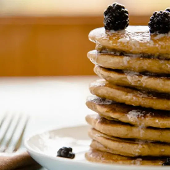 Stack of pancakes with blackberries