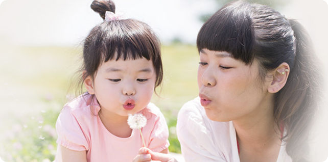 Mother and Daughter Photo Blowing Dandelion