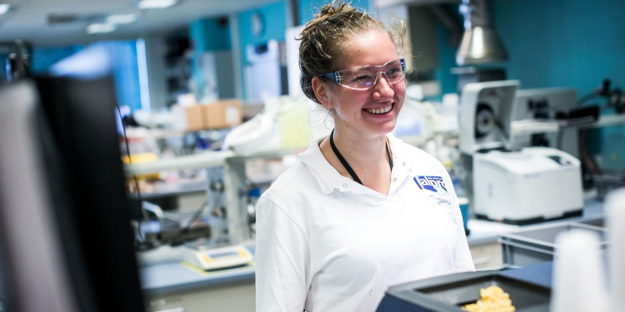 Alpro Wevelgem factory worker smiling