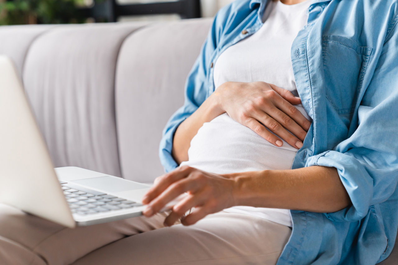 pregnant mum sat doing research