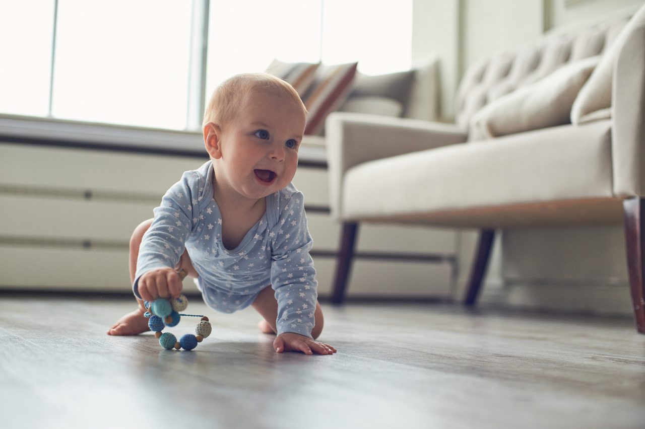 Baby playing on floor