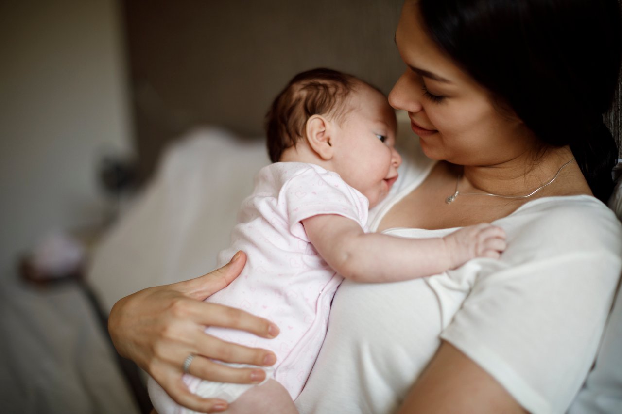 Mother sitting holding her baby