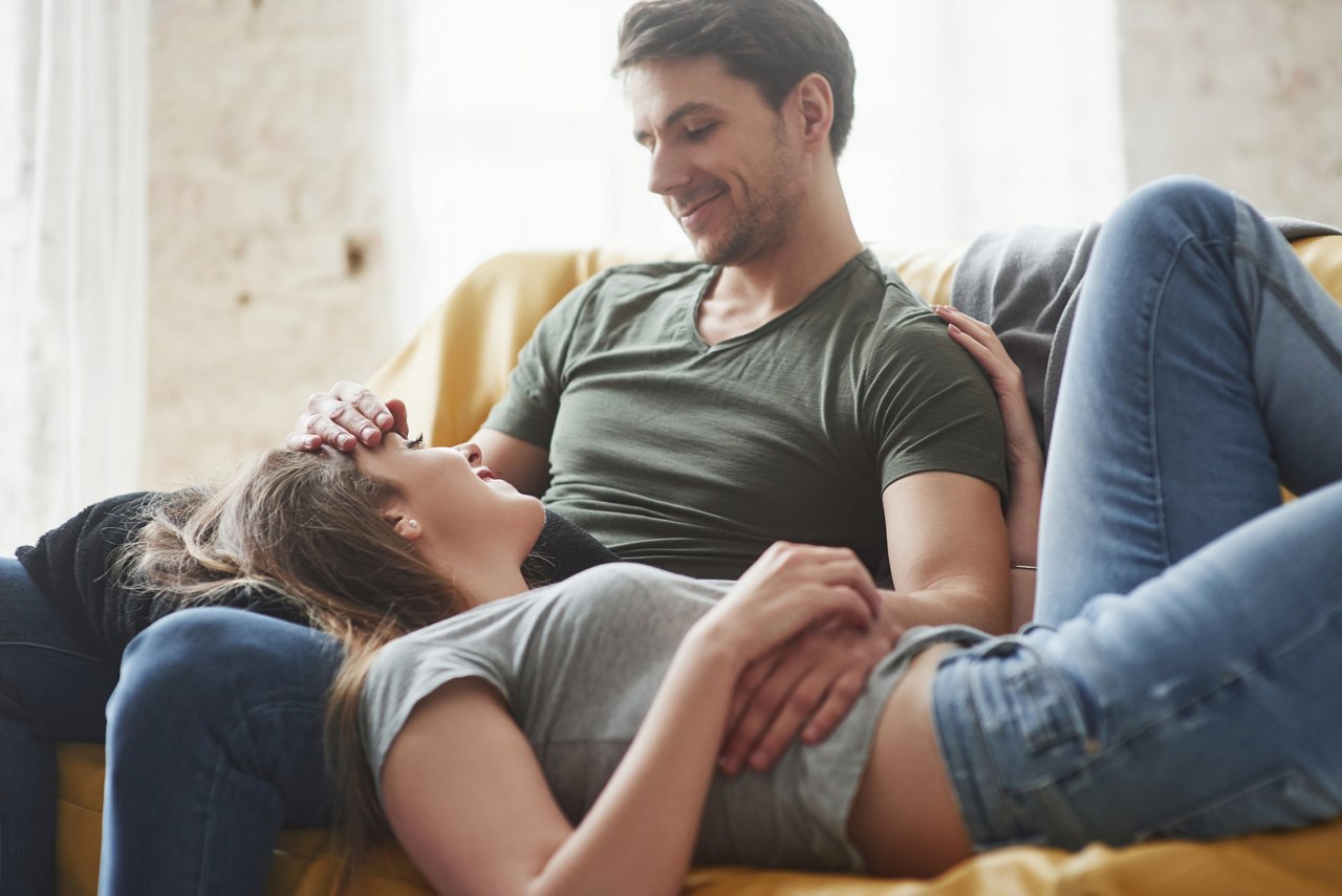 Couple laying on the couch together