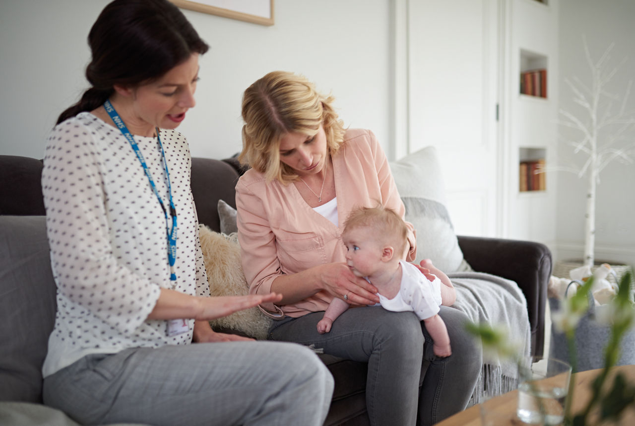 Mum interaction colic health check up with baby