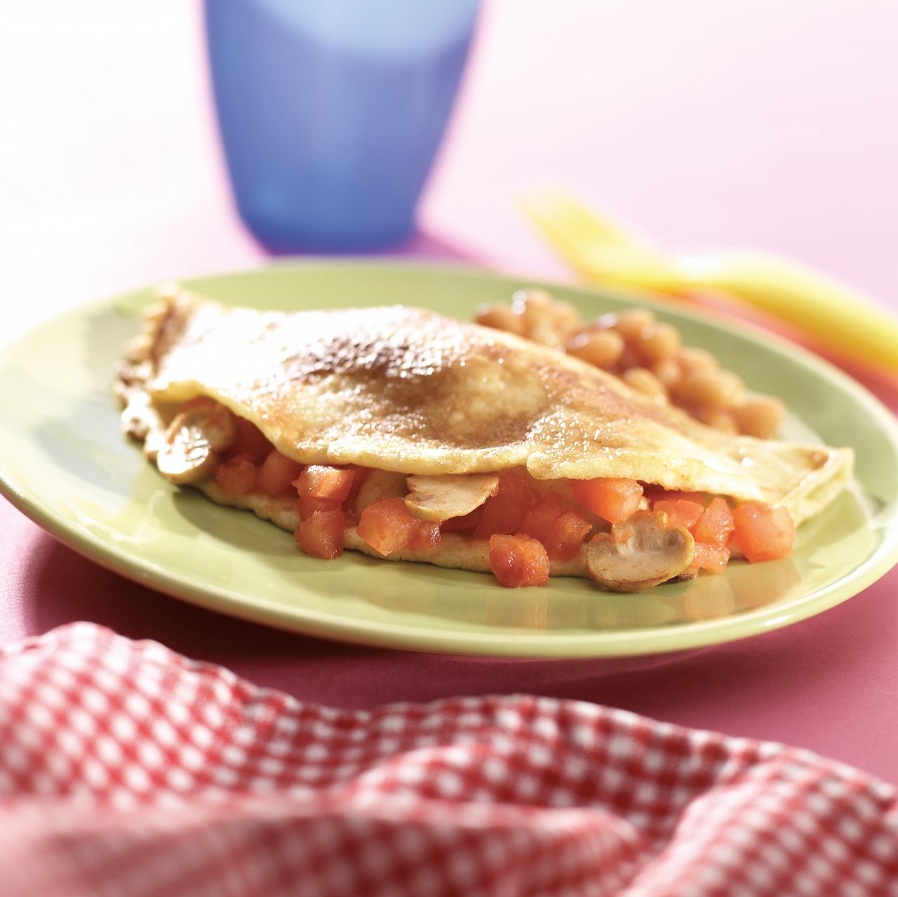 Omelette with tomato and mushroom filling image to accompany recipe