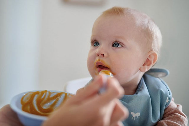 baby being spoon fed