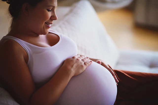 Expectant mother talking to unborn baby