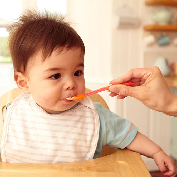 Baby eating spoon