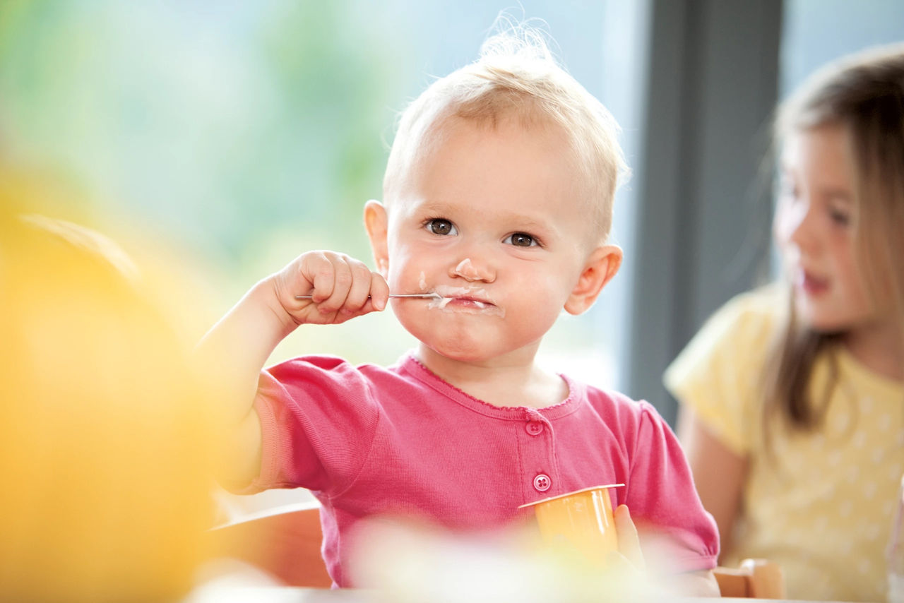 toddler with spon