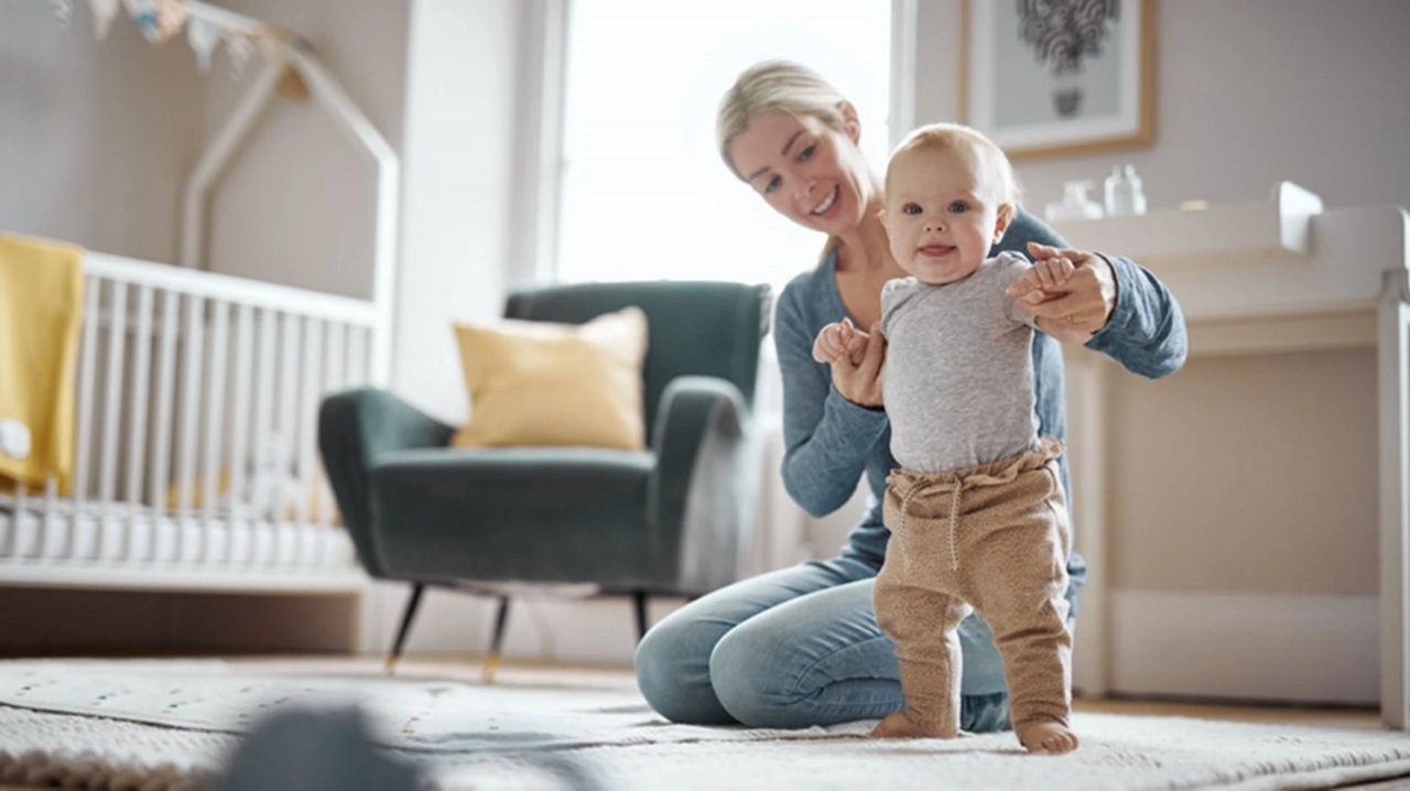 Baby learning best sale to stand up