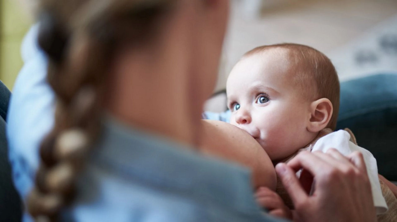 Mother winding baby