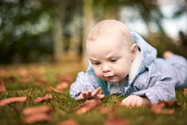 baby lying on ground