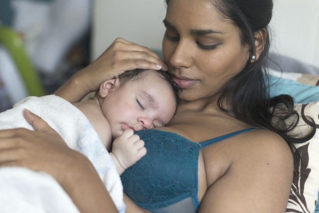 baby sleeping on mums chest