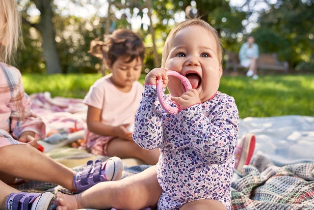 Mum spoon feeding baby