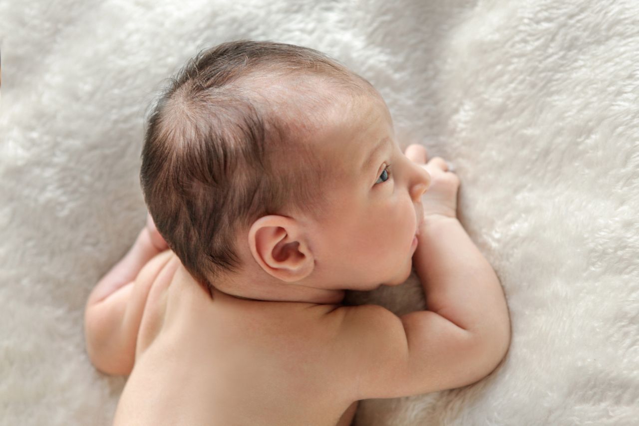 Newborn Baby lying on a blanket