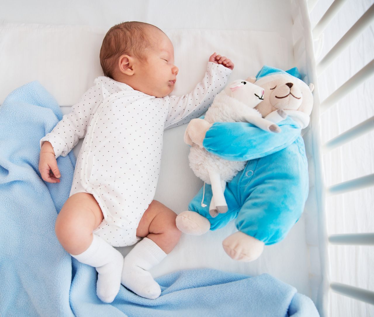 Newborn baby sleeping peacefully in the crib