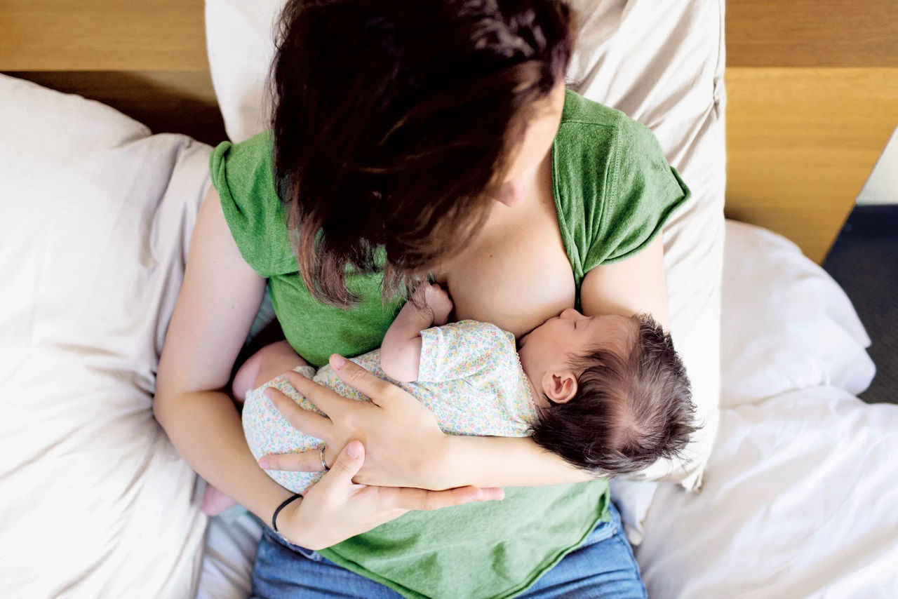 Mum and baby on bed