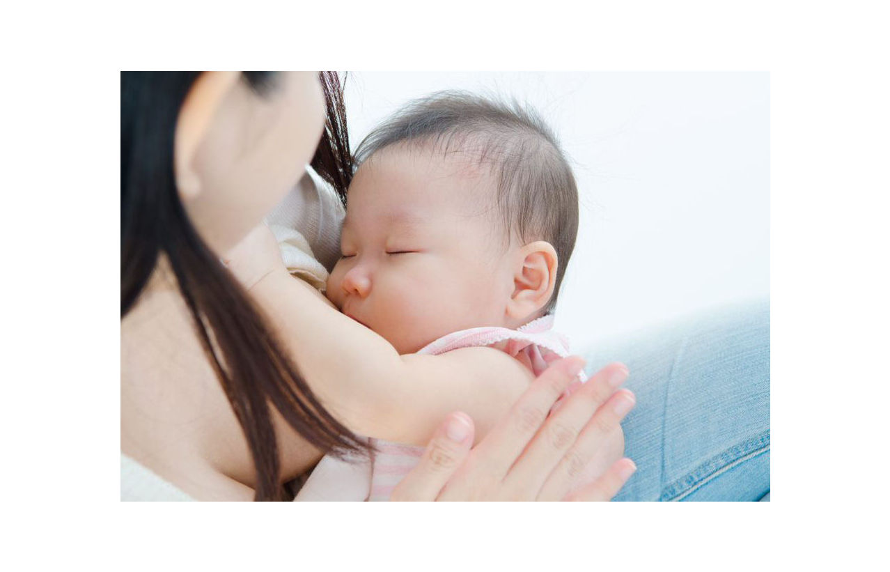 Mother breastfeeding baby