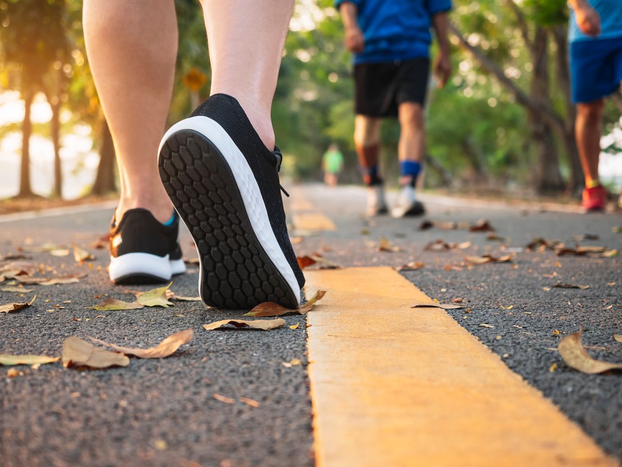 Man walk in park outdoor with People Jogging exercise Healthy lifestyle