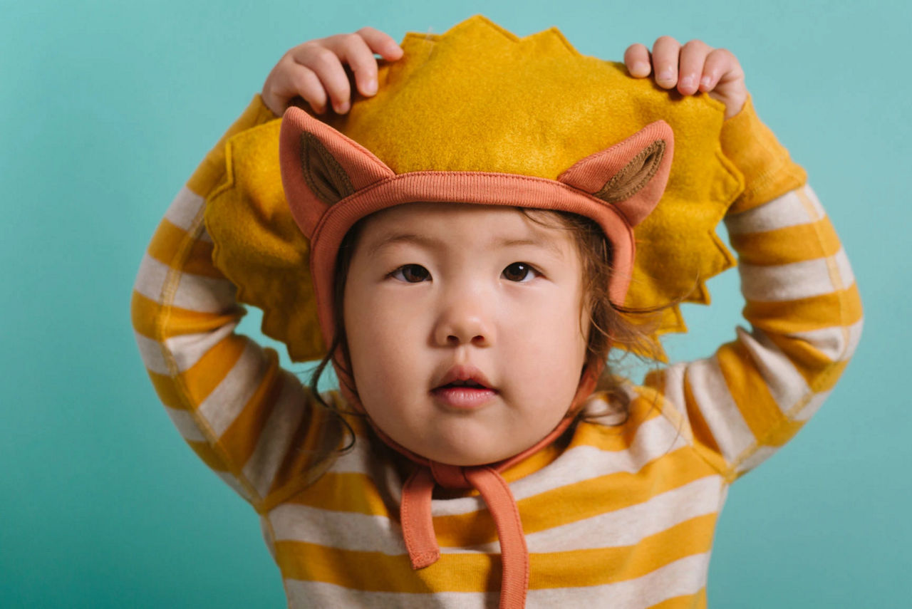 Boy in lion hat