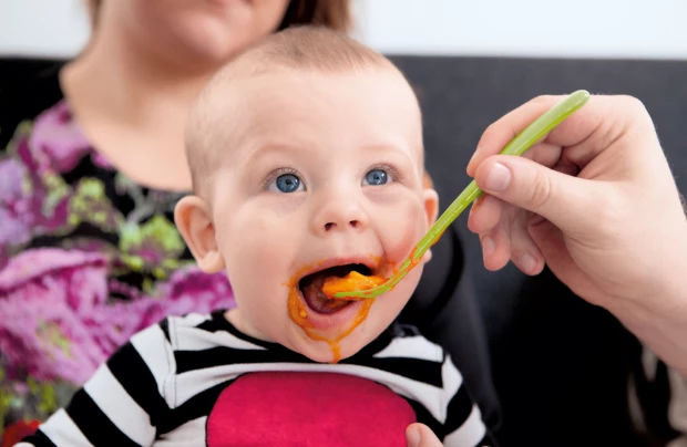 Baby eating porridge