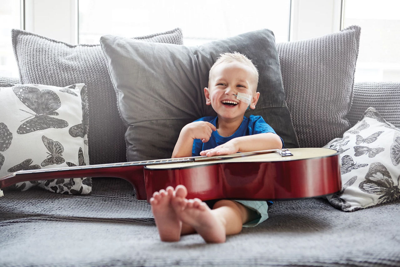 challenged-growth-happy-boy-guitar