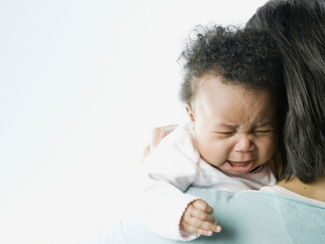 Constipated Baby On Mothers Shoulder