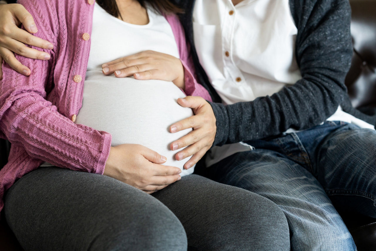 couple-holding-belly.jpg