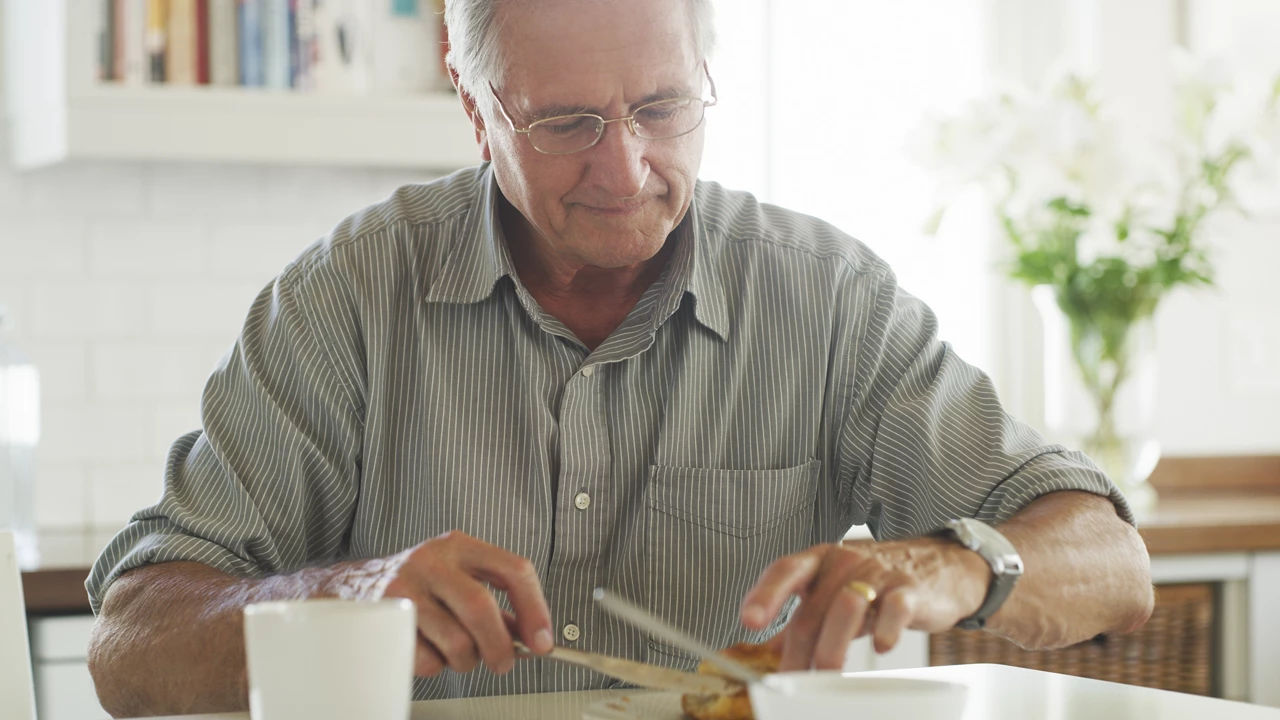 Senior man eating lunch