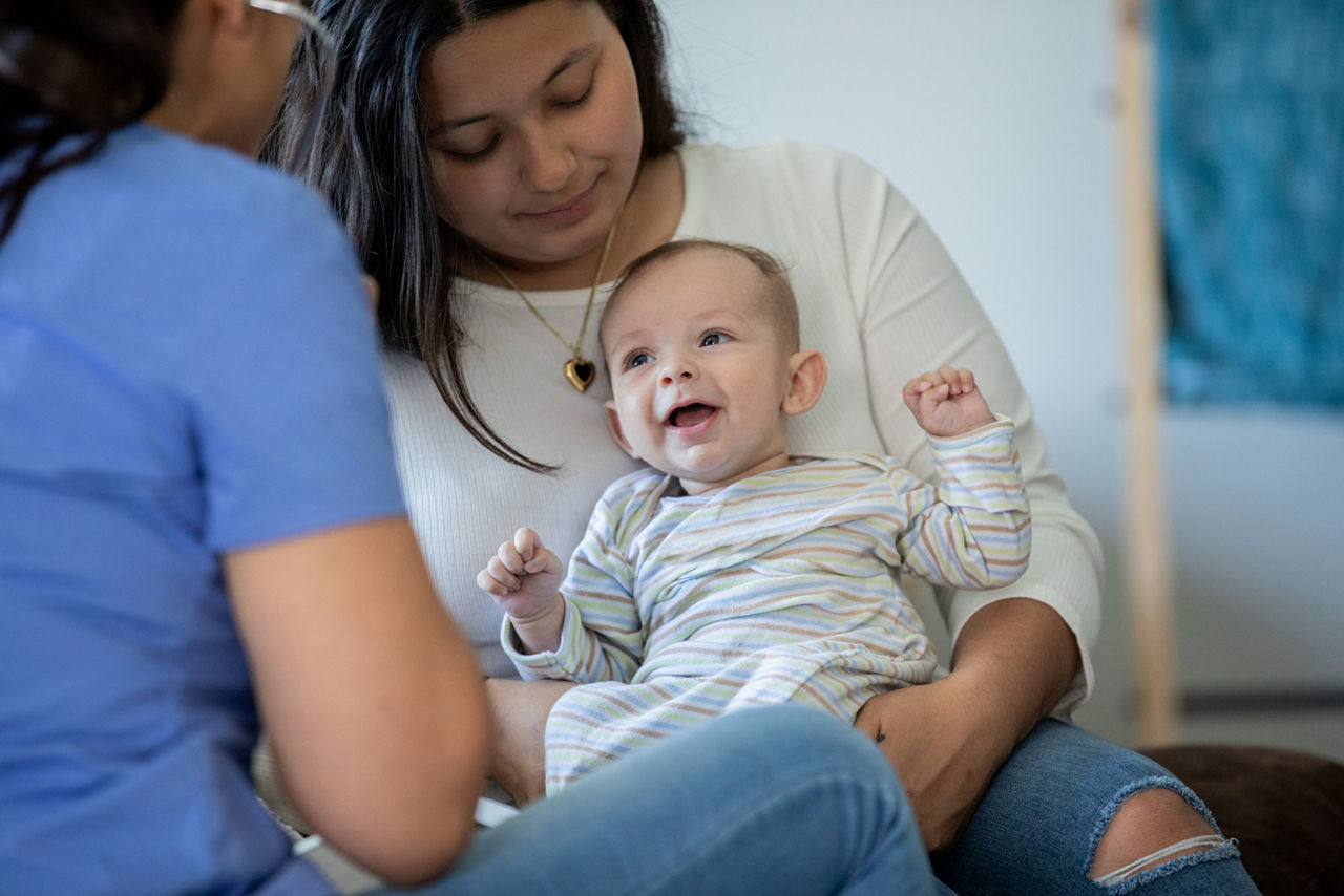 Toddler smiling at a GP examination