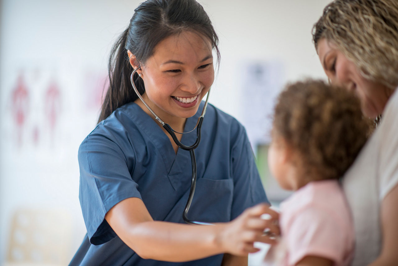 Nurse listening a toddler's chest