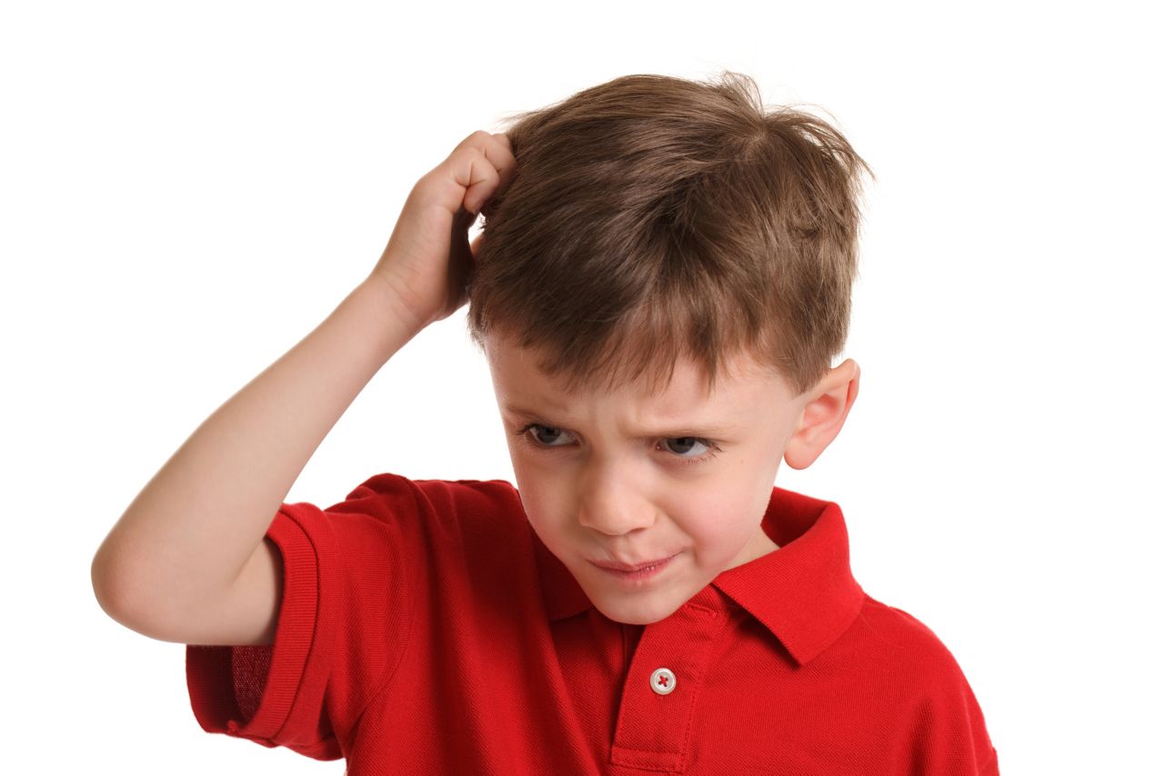 Portrait series of a 6 year old boy before and after a haircut. This is "after."