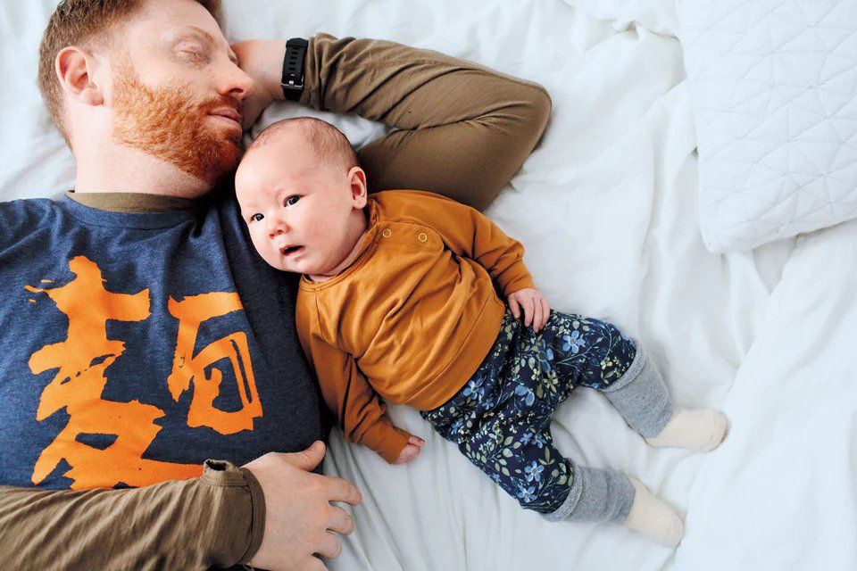 Dad and baby sleeping