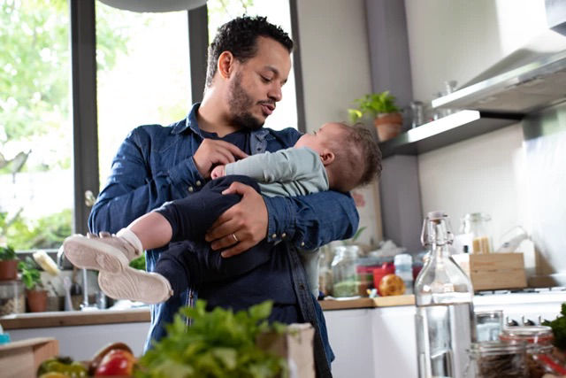 dad-holding-baby-kitchen